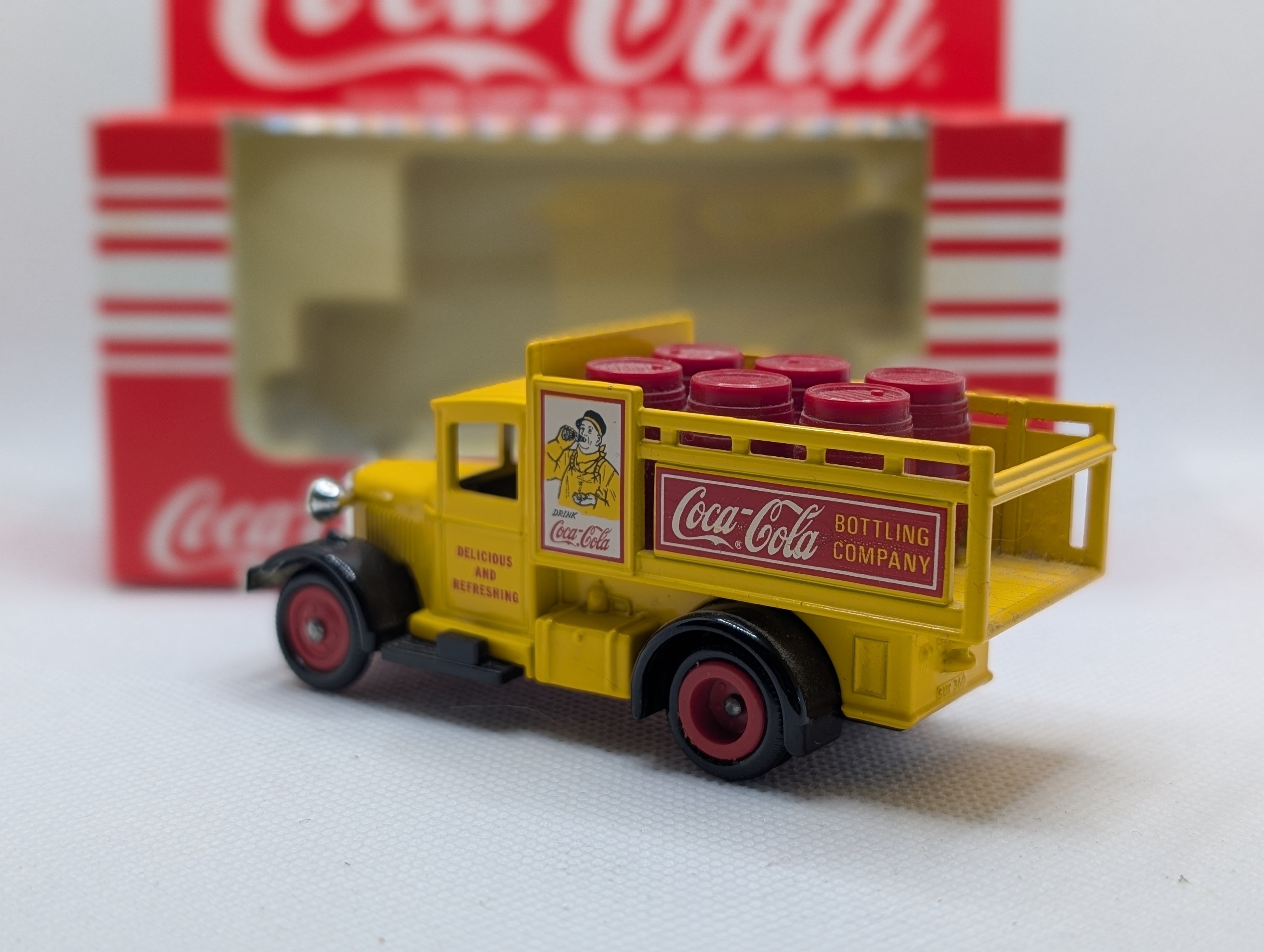 Lledo Days Gone DG20 Ford Model A Stake Truck - Coca-Cola Yellow with Red Barrels (Boxed)