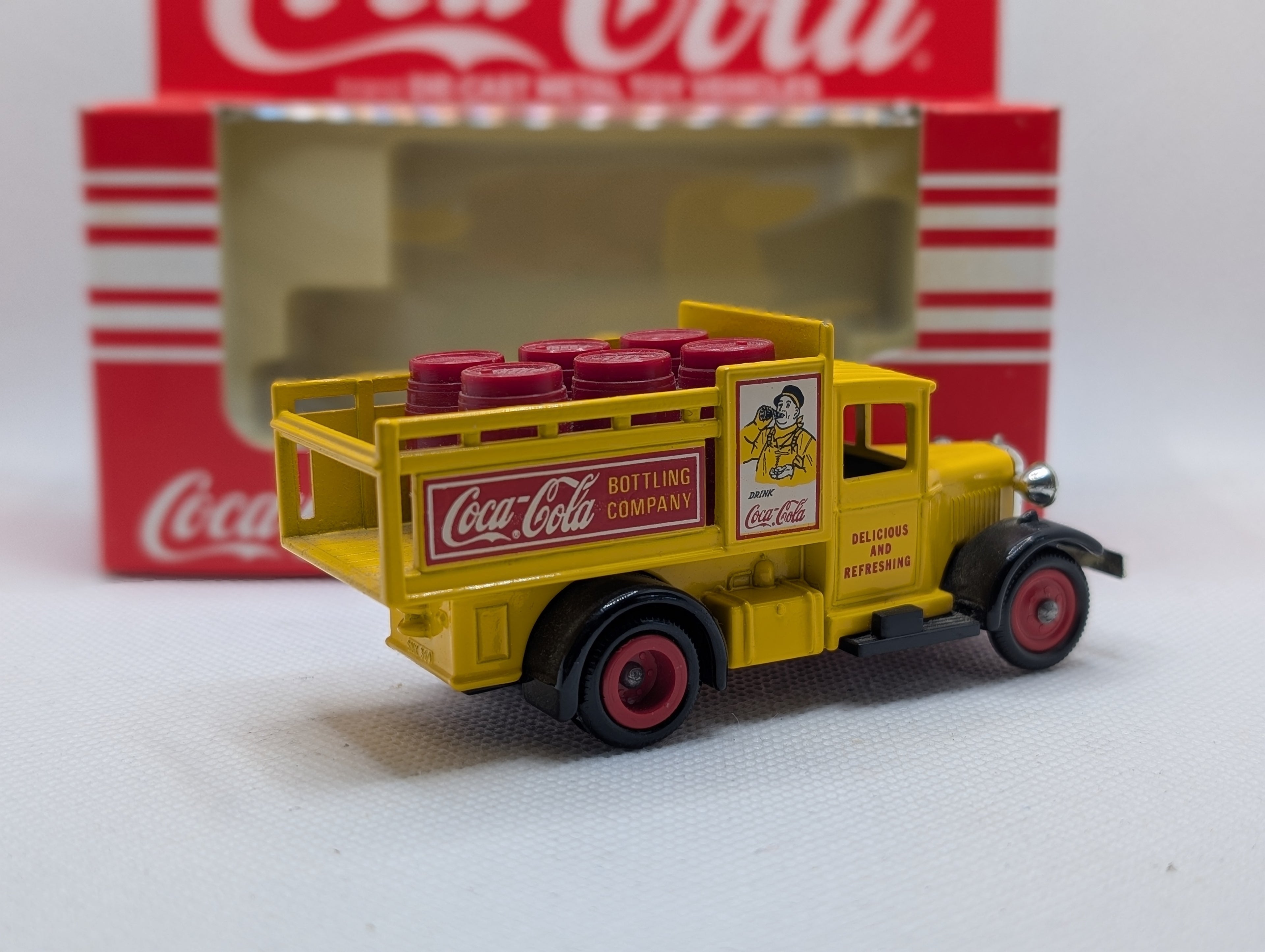 Lledo Days Gone DG20 Ford Model A Stake Truck - Coca-Cola Yellow with Red Barrels (Boxed)