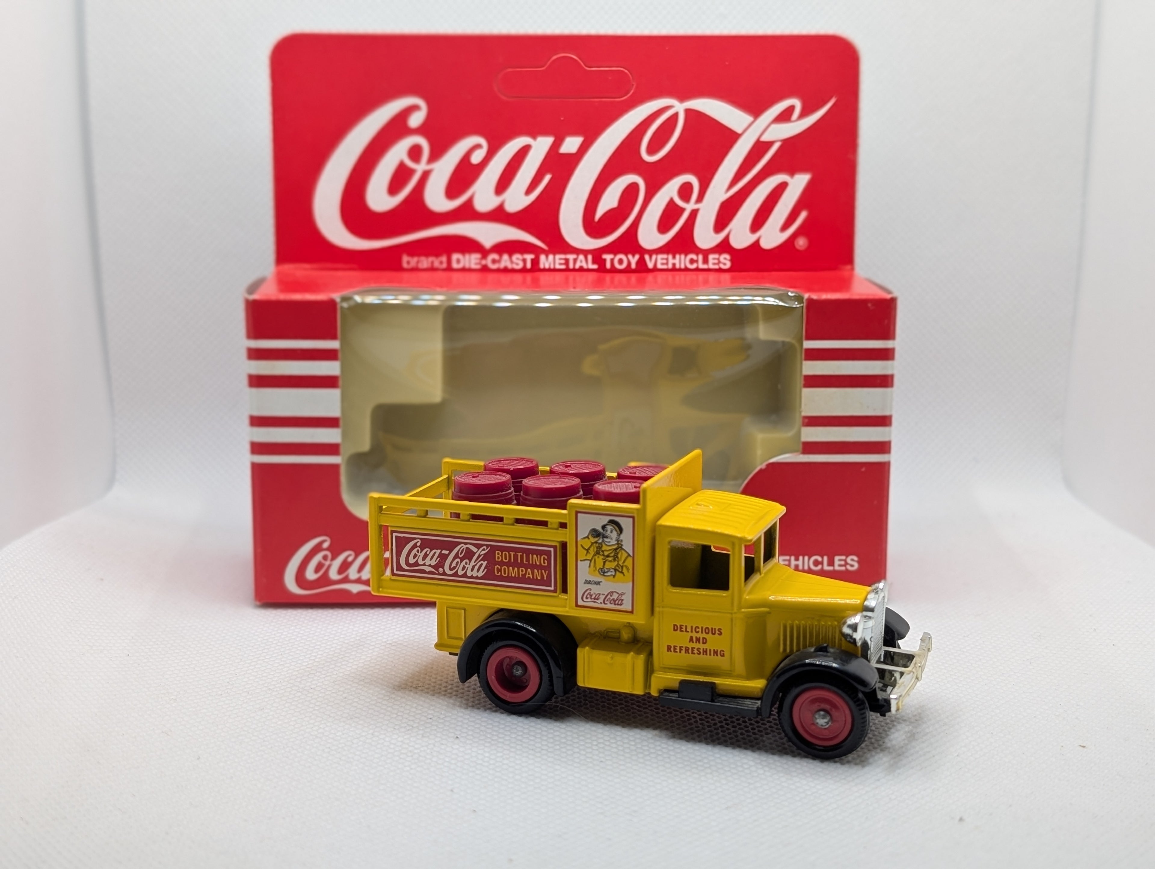 Lledo Days Gone DG20 Ford Model A Stake Truck - Coca-Cola Yellow with Red Barrels (Boxed)