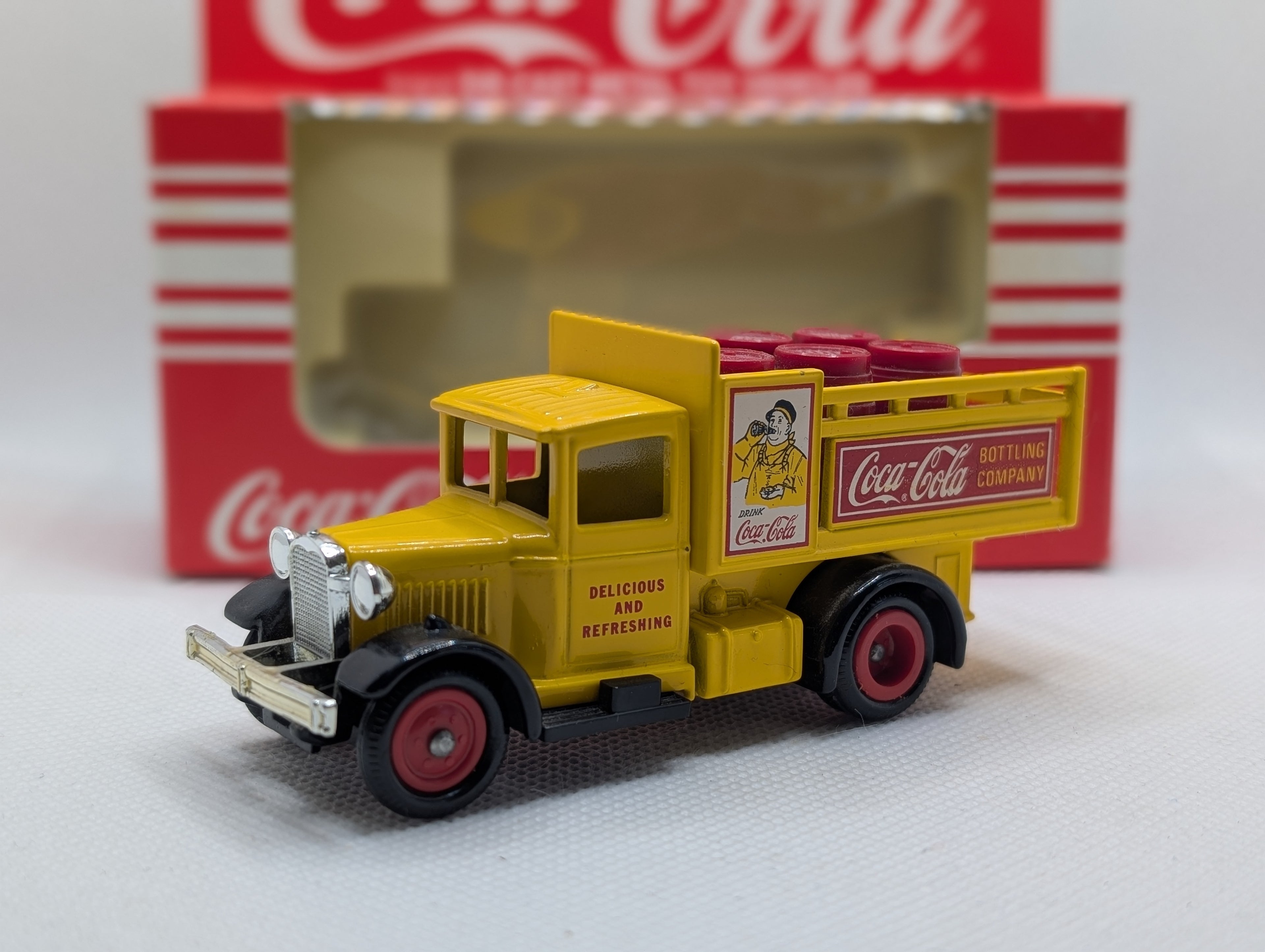 Lledo Days Gone DG20 Ford Model A Stake Truck - Coca-Cola Yellow with Red Barrels (Boxed)